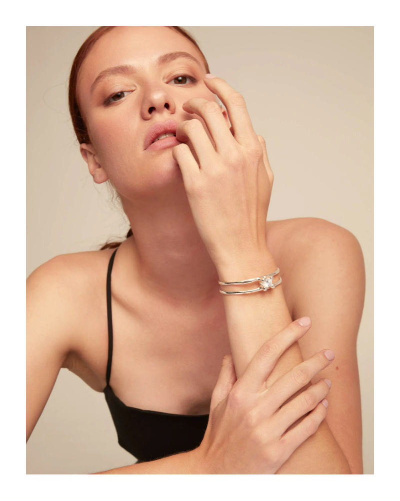 PULSERA RIGIDA PLATEADA DE UNOde50