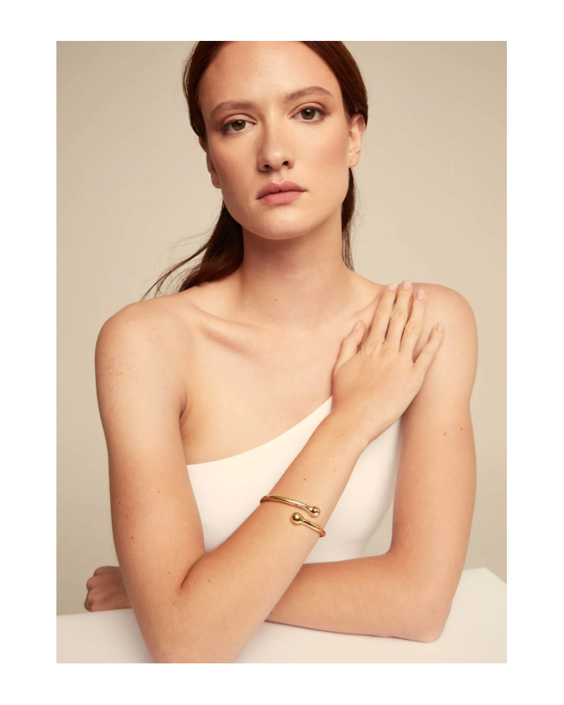 PULSERA RIGIDA BAÑADA EN ORO DE UNOde50