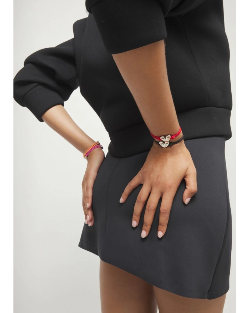 Pulsera elàstica con corazòn baño plata UNOde50