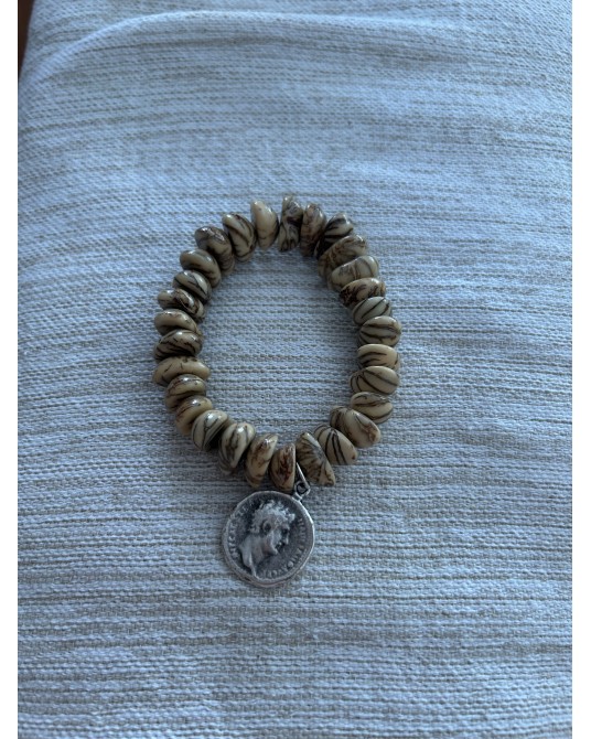 Pulsera de semillas con moneda elàstica
